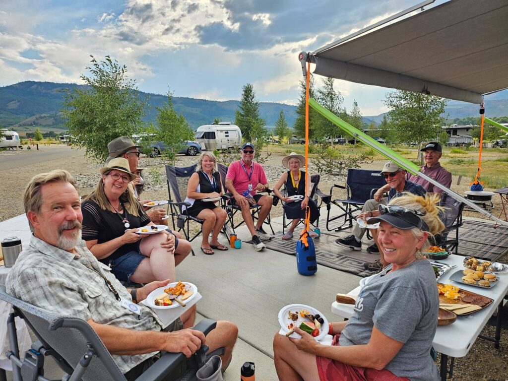 Airstream club members enjoying happy hour at Region 11 rally in Granby Colorado