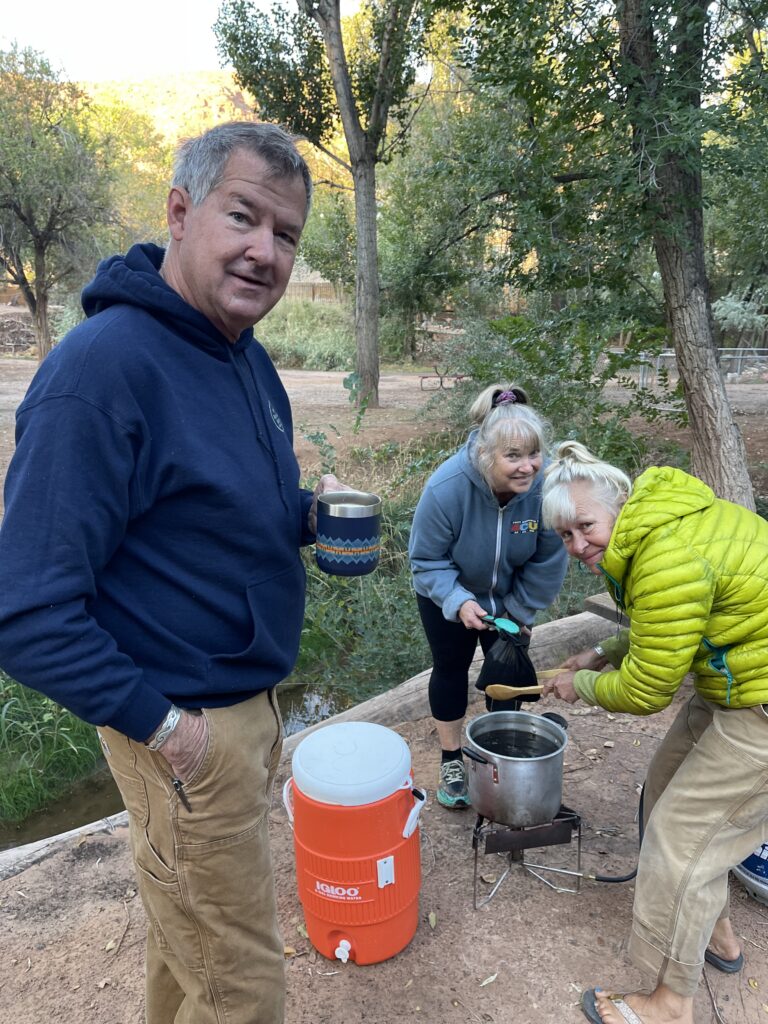 Airstream club members making cowboy coffee at an Airstream Rally in Utah