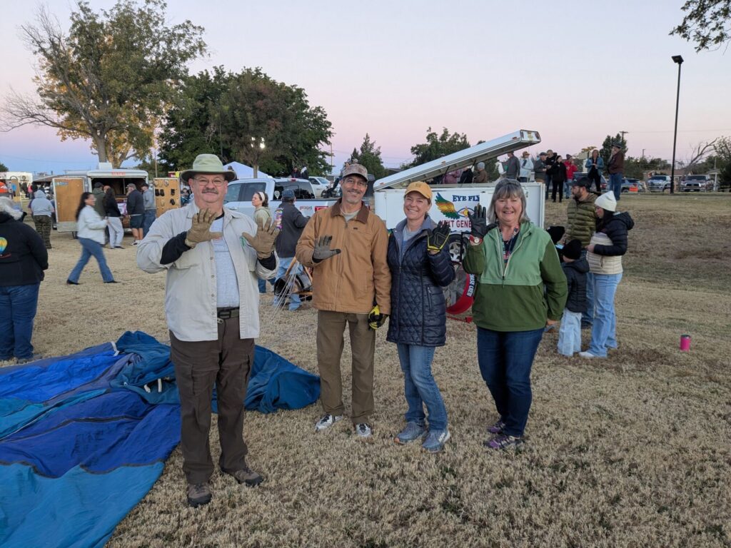 Airstream club members assisting with hot air balloon ascension preparations during an Airstream Rally in New Mexico