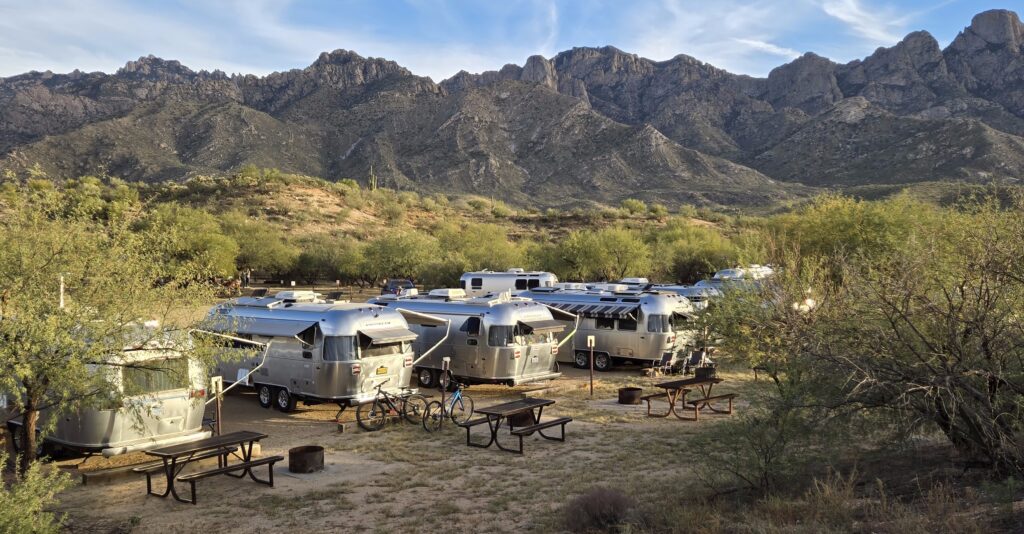 Airstream Club members of the Four Corners Unit at the Tucson Unplugged Rally, Catalina State Park in Tucson, Arizona with the Catalina Mountains in the background