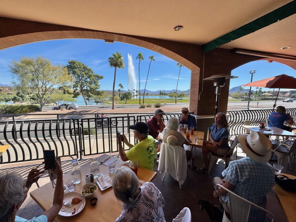 Four Corners Unit Airstream club members enjoying lunch and watching the Fountain Hills fountain during an airstream club rally at McDowell Mountain Regional Park in Arizona