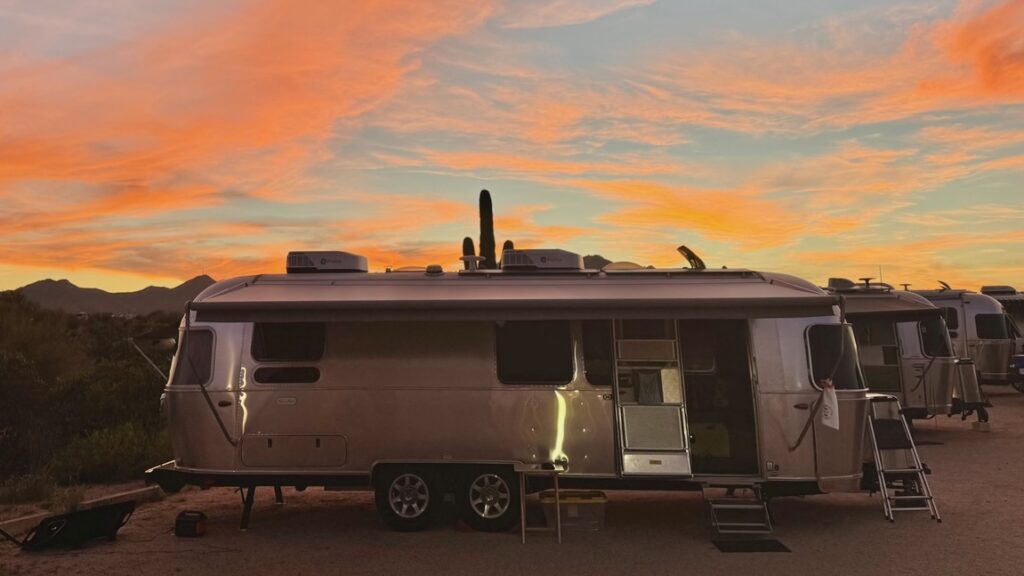 Airstream trailers at sunset at a four corners unit airstream club rally at McDowell Mountain Regional Park in Fountain Hills, Arizona